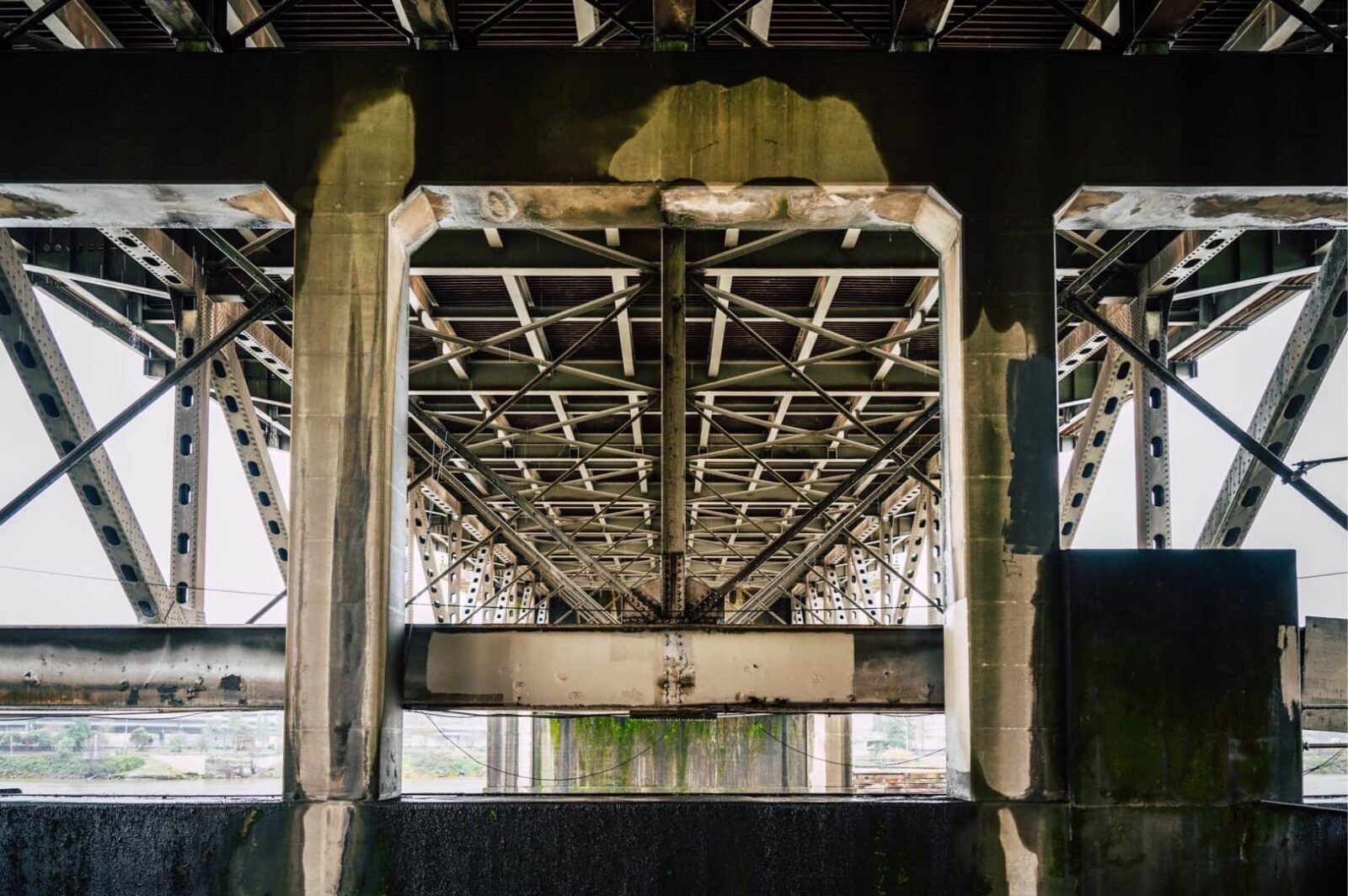 A high-fidelity architectural cross-section revealing a pristine, perfectly structured upper tier resting heavily upon a crumbling, chaotic foundation.