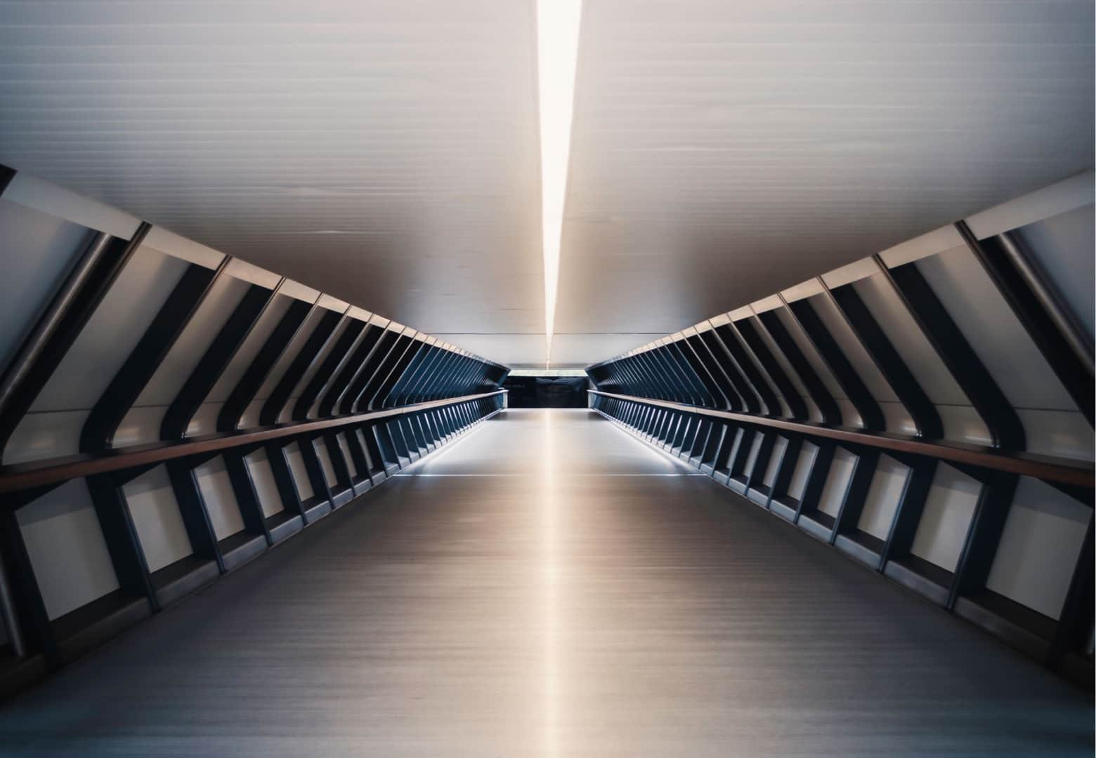 A highly sophisticated, minimalist architectural space featuring a single, illuminated focal point, representing the power of subtraction.